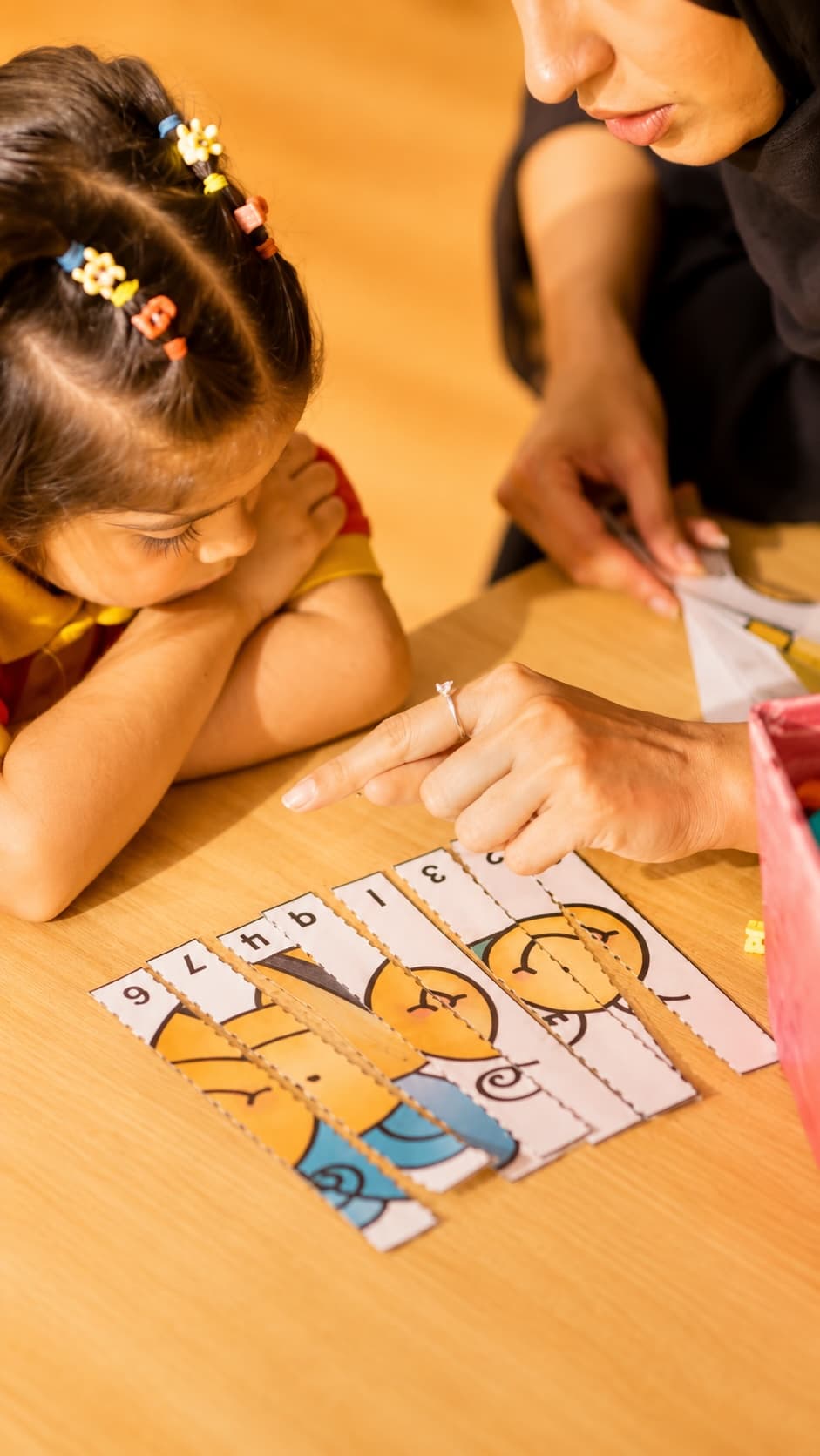 A child engaged in hands-on learning at The Aster School