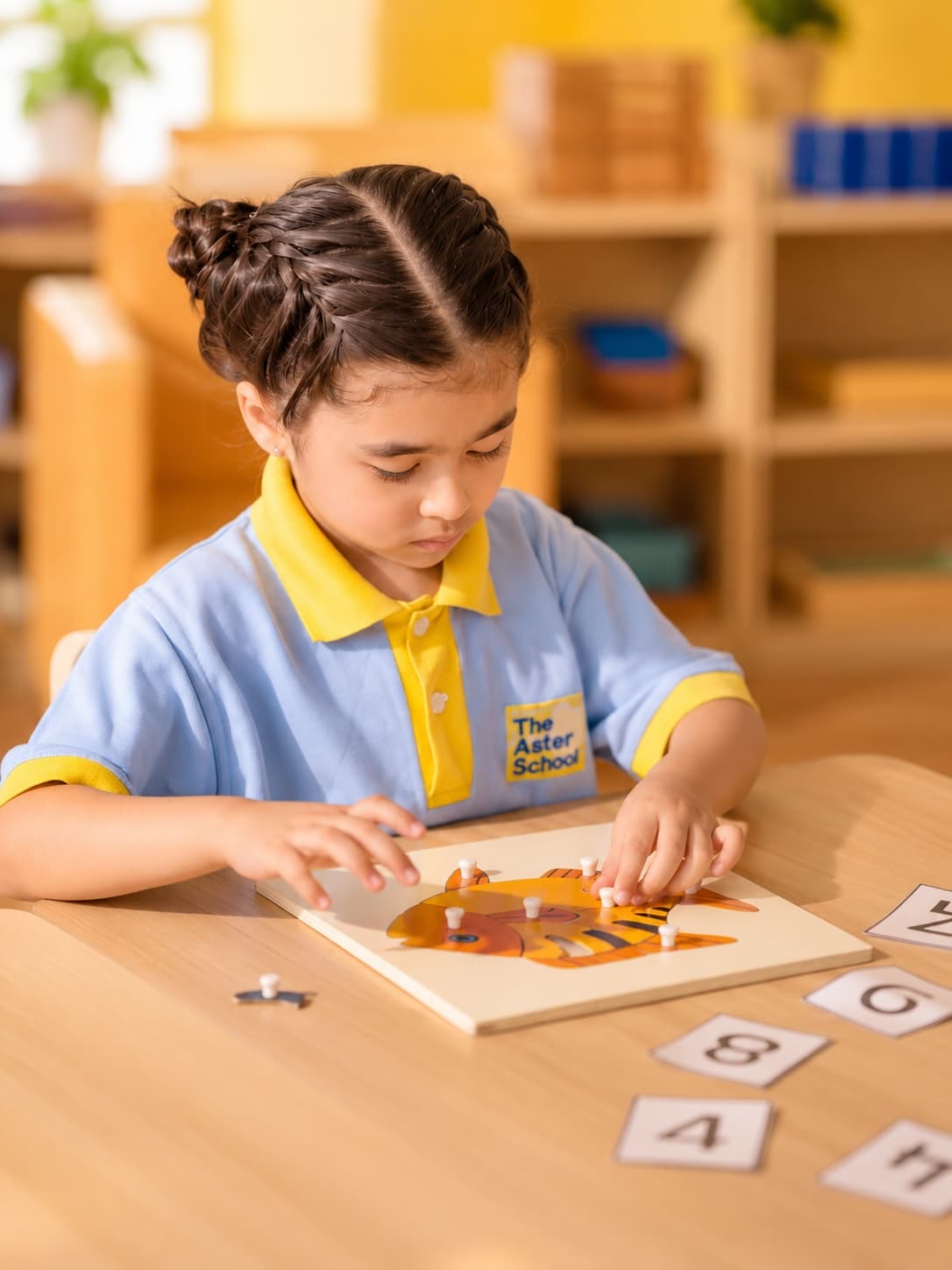 A parent and toddler engaging in a shared learning moment at Aster Stars