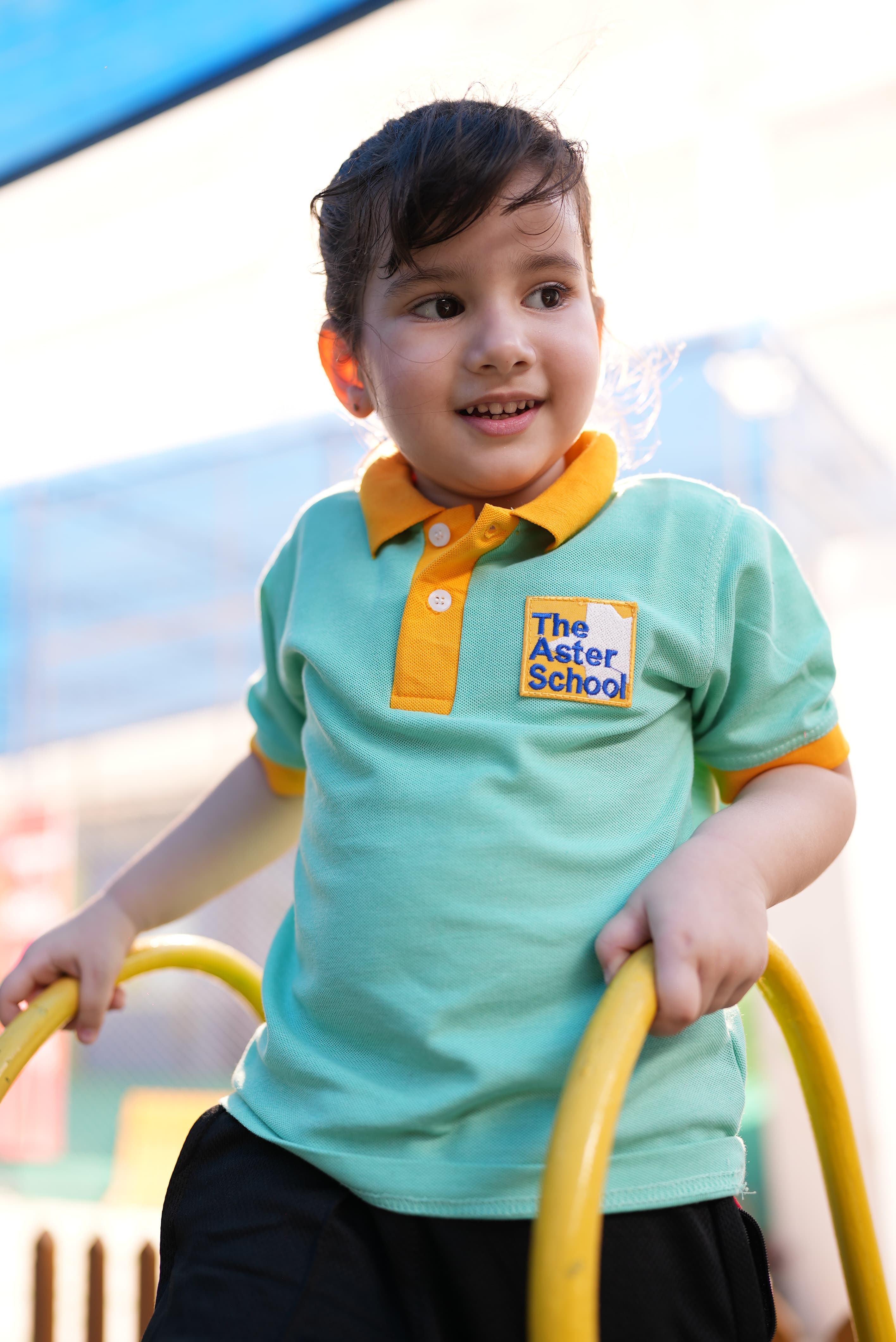 A young learner enjoying the outdoor play area
