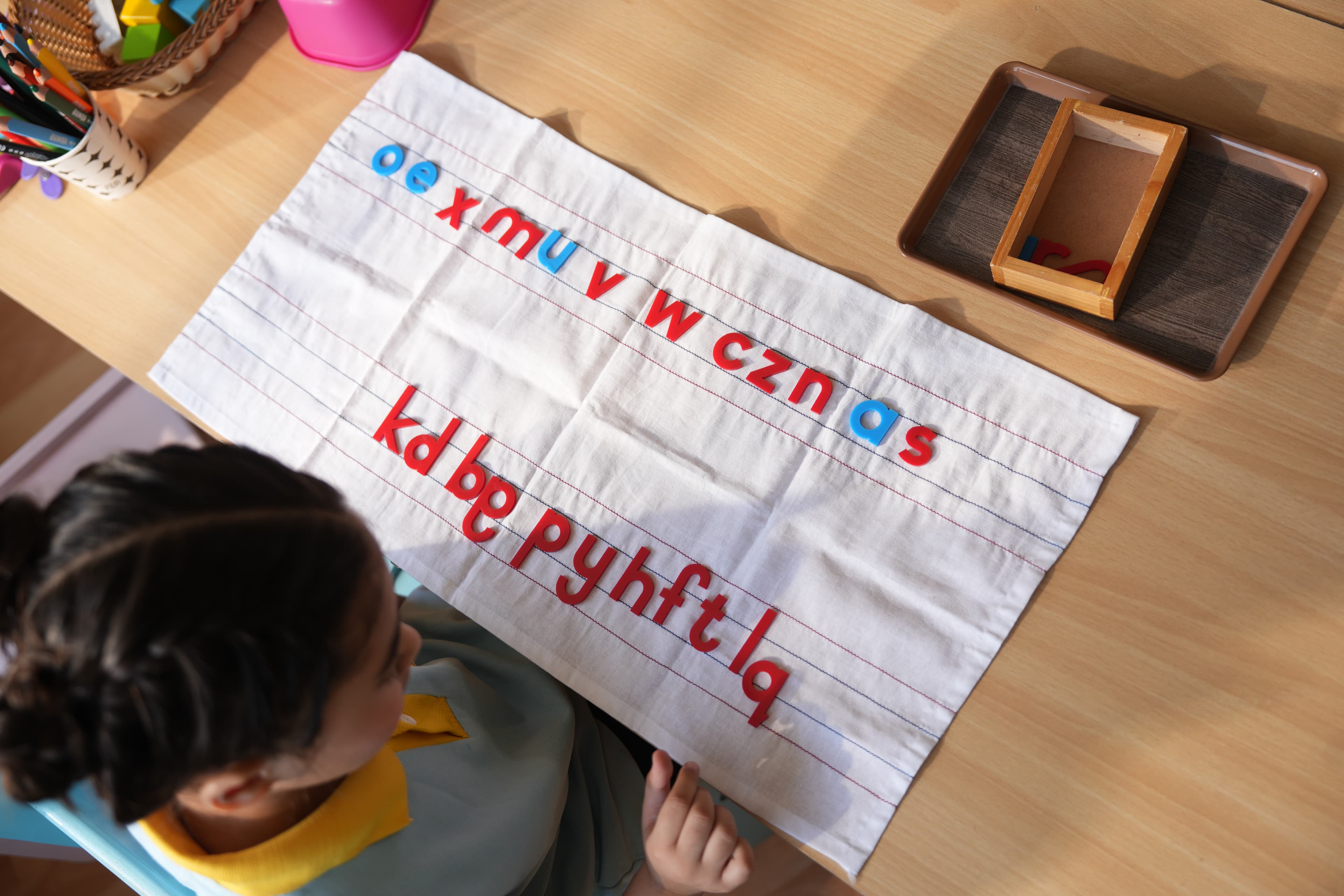 Children exploring creative materials at Aster