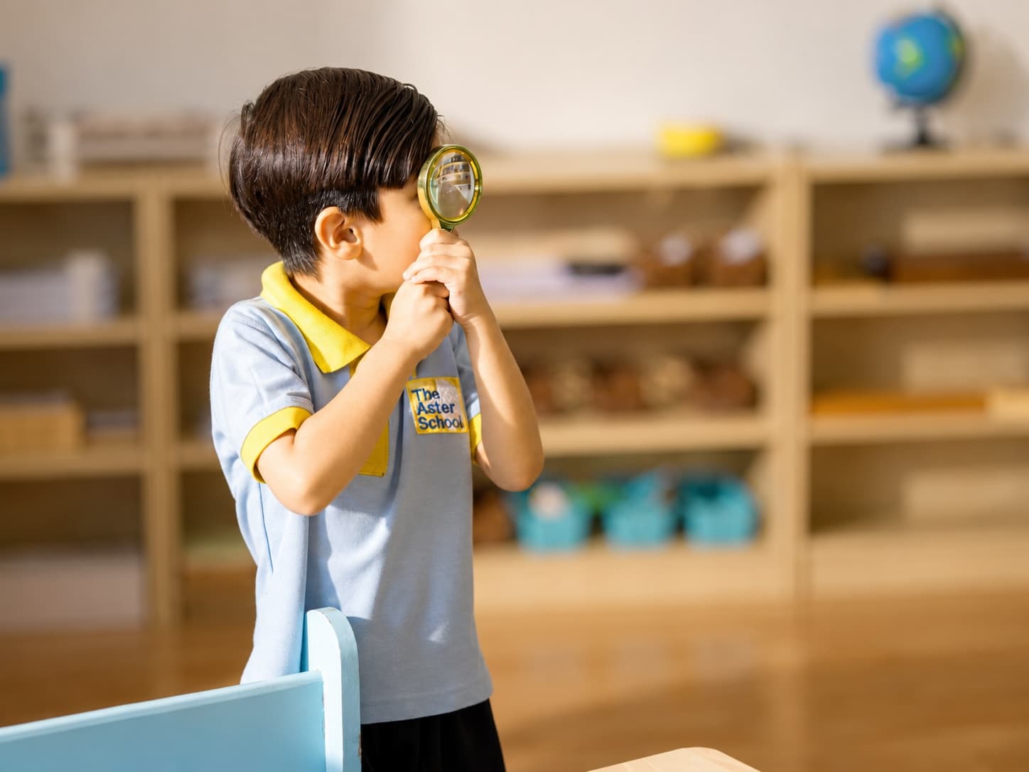 Aster toddlers engaged in sensory and practical-life work